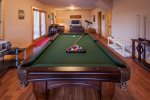 Terrace level with a flat screen tv and pool table